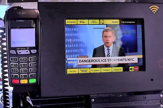 Pat Kiernan delivers the news to taxi riders.